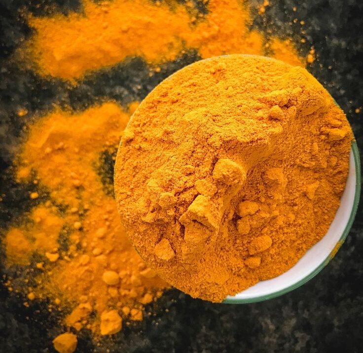 Premium Indian turmeric powder in a bowl ready for export.